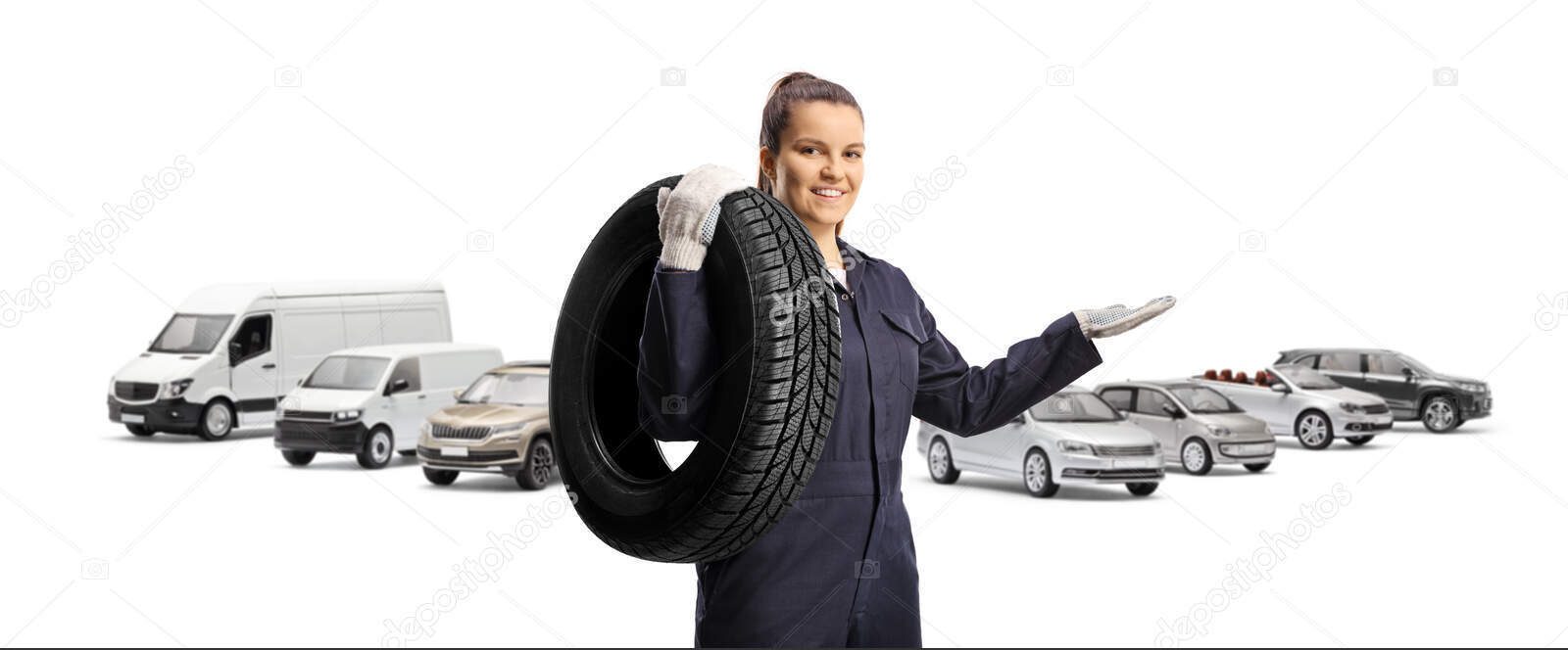 depositphotos 737820168 stock photo female auto mechanic carrying tire